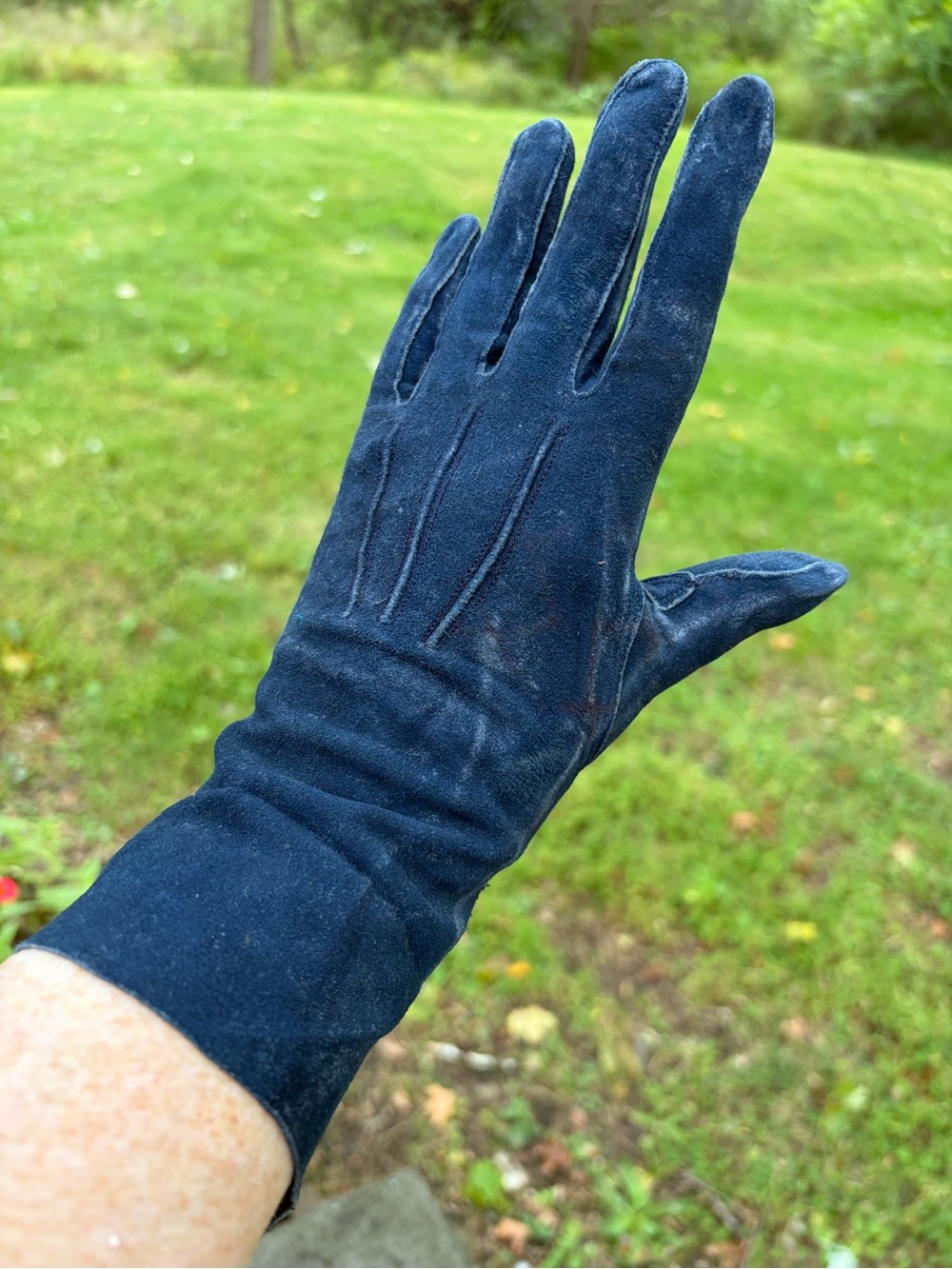Women's small blue suede gloves stamped with the brand name "KISLAV"
